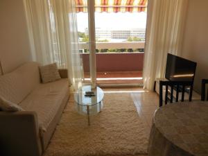 a living room with a couch and a glass table at Apartments with WiFi Split - 11692 in Split