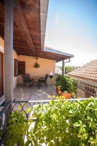 a patio with a table and chairs on a house at Apartments by the sea Selce, Crikvenica - 11693 in Selce