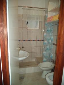 a small bathroom with a sink and a toilet at Apartments by the sea Kabli, Peljesac - 11695 in Brijesta