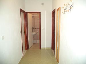 a hallway with a bathroom with a sink and a toilet at Apartments by the sea Kabli, Peljesac - 11695 in Brijesta