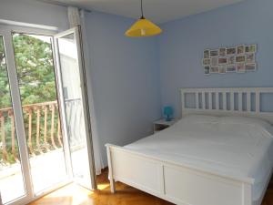 Posteľ alebo postele v izbe v ubytovaní Apartments with WiFi Bol, Brac - 11728