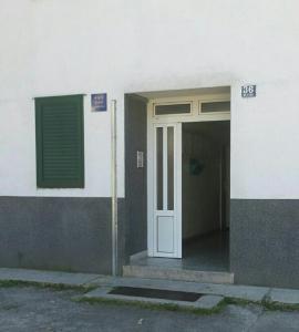 an entrance to a building with a door at Apartments with a parking space Split - 11726 in Split