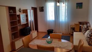 a living room with a table and a couch at Apartments with WiFi Split - 11784 in Split