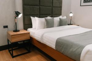 Postel nebo postele na pokoji v ubytování El Sancho Hotel