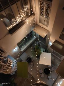 an overhead view of a room with a christmas tree and lights at The Assembly Place, A Co-living at Mayo in Singapore