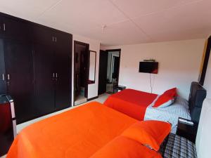 מיטה או מיטות בחדר ב-Hotel casa Mia