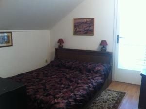a bedroom with a bed in a room at Seaside holiday house Orebic, Peljesac - 11853 in Orebić