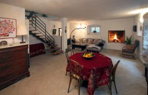 a living room with a table with a red table cloth at Seaside holiday house Orebic, Peljesac - 11853 in Orebić