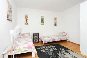 a room with a bed and a chair and a rug at Apartments with a parking space Split - 11863 in Split
