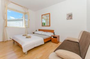 Postel nebo postele na pokoji v ubytování House Beach house Toma