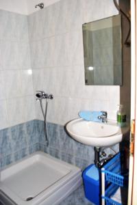 a bathroom with a sink and a mirror and a tub at Apartments with a parking space Kosi, Labin - 11891 in Labin