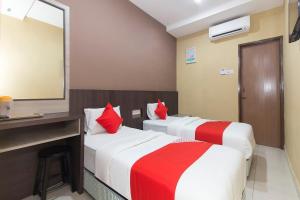 Postel nebo postele na pokoji v ubytování Silibin Times Inn Hotel + 17 fotografií