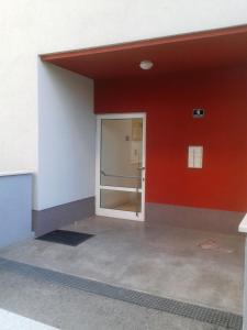 a door in a building with a red wall at Apartments with WiFi Split - 12072 in Split