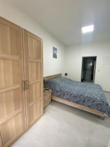 Postel nebo postele na pokoji v ubytování 1-C Superbe appartement très calme et bien décoré