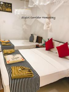 Postel nebo postele na pokoji v ubytování Sigiri Corridor Home Stay