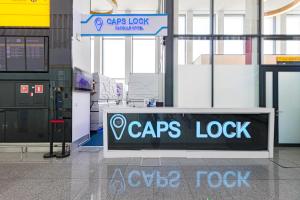 a lobby with a copes lock sign in a building at CAPS LOCK Airport Hotel in Astana