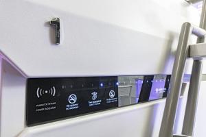 a close up of a control panel on an airplane at CAPS LOCK Airport Hotel in Astana