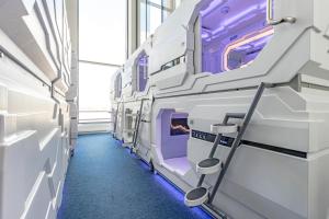 a row of beds in a hospital room at CAPS LOCK Airport Hotel in Astana