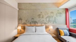 ibis Bengaluru Hebbal - An Accor Brand客房内的一张或多张床位