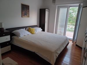 Postel nebo postele na pokoji v ubytování Two bedroom Apartment Libertas