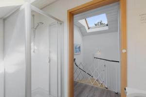 a door leading into a hallway with a skylight at Ferienhaus Diane in Kirchheim