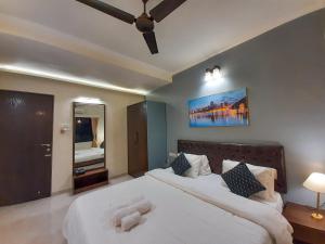 Postel nebo postele na pokoji v ubytování Luna Villa by Angel Stay - Three Bedroom Villa in Lonavala
