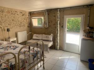 Postel nebo postele na pokoji v ubytování Petit gîte à la ferme des buttons