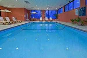 a large swimming pool in a hotel room at Holiday Inn Express Indianapolis South by IHG in Indianapolis