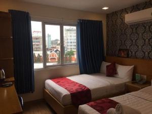 Postel nebo postele na pokoji v ubytování Ailen Garden 2 Hotel