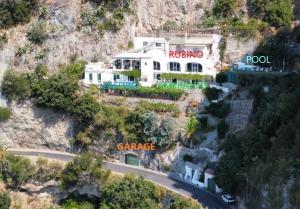 a house on the side of a mountain at Villa Carmela in Conca dei Marini