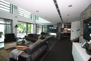 a living room with a couch and a fireplace at Villa Hanan Sarajevo in Sarajevo