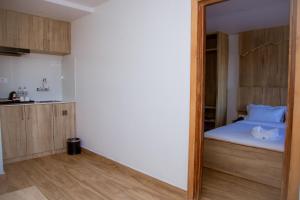 Un pat sau paturi într-o cameră la Stay Inn Hotel and Apartment Pokhara