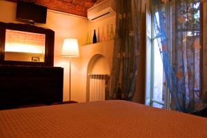 מיטה או מיטות בחדר ב-Citta Giardino B&B