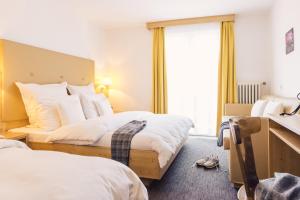 Postel nebo postele na pokoji v ubytování Posthotel