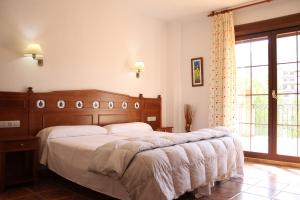 Posteľ alebo postele v izbe v ubytovaní Hospedería Los Cahorros