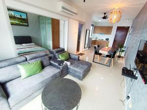 a living room with a couch and a table at Netflix # Sky Suite near Jaya One by Salaam Suites, 2 pax in Petaling Jaya
