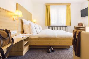 Postel nebo postele na pokoji v ubytování Posthotel