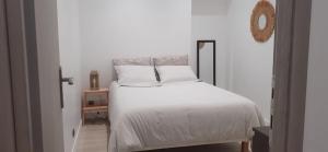 Ένα ή περισσότερα κρεβάτια σε δωμάτιο στο Appartement au coeur de Marans