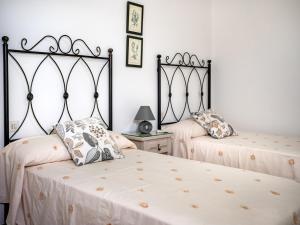 Łóżko lub łóżka w pokoju w obiekcie PARAISO RIAS BAIXAS II Combarro
