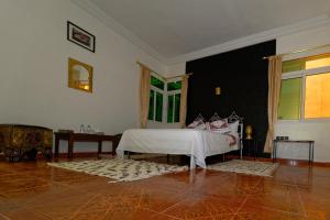 Postel nebo postele na pokoji v ubytování Riad Parfums de OUARZAZATE