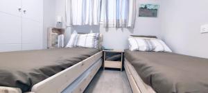 Postel nebo postele na pokoji v ubytování Dunas Beach Apartment
