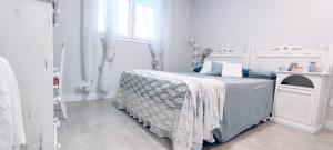 Postel nebo postele na pokoji v ubytování Dunas Beach Apartment