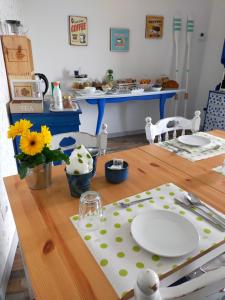 a dining room table with a plate on top of it at BnB La Casina dei Nonni in Campofilone +35 photos