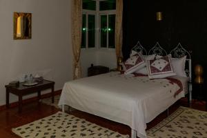 Postel nebo postele na pokoji v ubytování Riad Parfums de OUARZAZATE