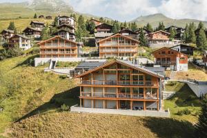 a group of houses on top of a hill at Pranursa in Arosa