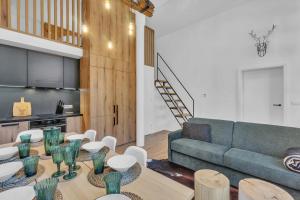 a living room with a couch and a table at Deer Apartment in Rokytnice nad Jizerou