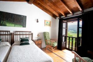 Postel nebo postele na pokoji v ubytování Hotel Rural Valleoscuru