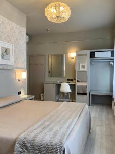 Postel nebo postele na pokoji v ubytování Hotel La Pace