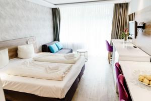 Postel nebo postele na pokoji v ubytování Haus am See Luxury HS 225 B