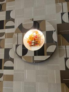 a plate of food sitting on a table at Hotel La Pace in San Mauro Torinese